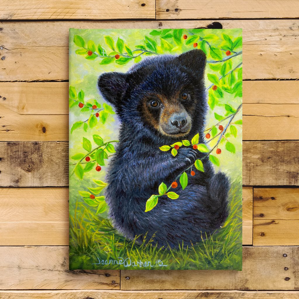 Huckleberry Bear - Black bear cub canvas art print on wood shiplap by artist Jeanne Warren