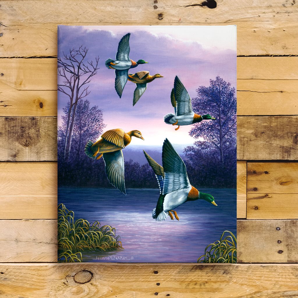 Mallard Ducks in Flight Art Print - Green Heads: Five mallard ducks descending over a tranquil purple lake at dusk, with silhouetted trees and marsh grass against a twilight sky. Three males display distinctive green heads while two females show brown plumage, all captured in graceful landing positions.
