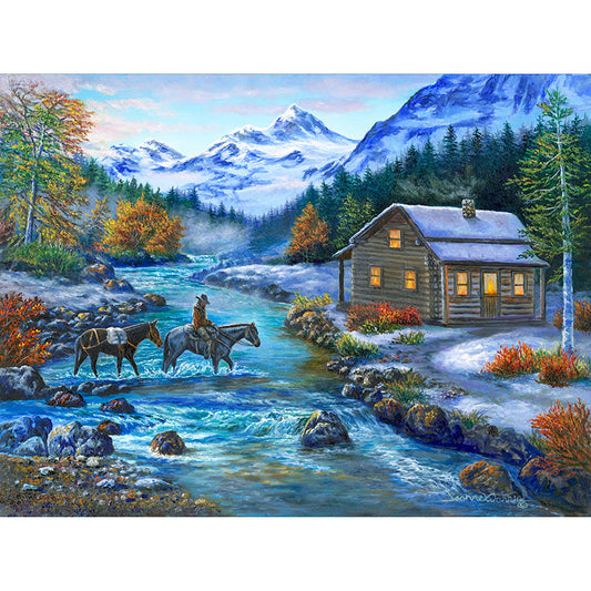 A homesteader rides on horseback with pack mule in tow across a river toward a warmly lit log cabin. The scene is set in winter with snow covered mountains in the background. 'Home for Supper' oil painting by artist Jeanne Warren.